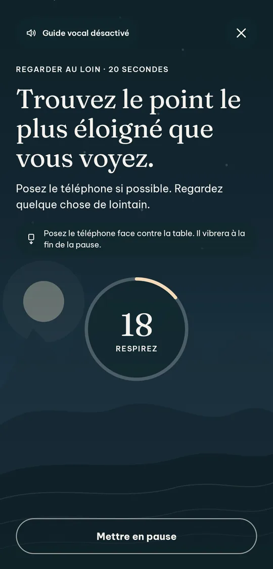 La pause de 20 secondes : un anneau de décompte sur un paysage de montagnes et le conseil de poser le téléphone